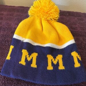 Michigan beanie hat with a ball on the top blue yellow white excellent condition